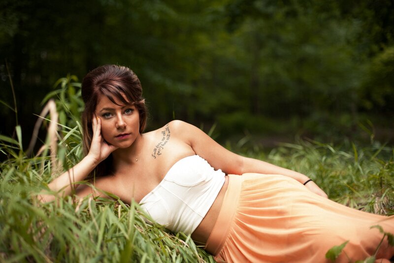 woman in grassy field