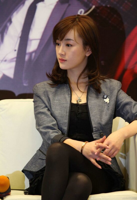 woman in gray blazer sitting