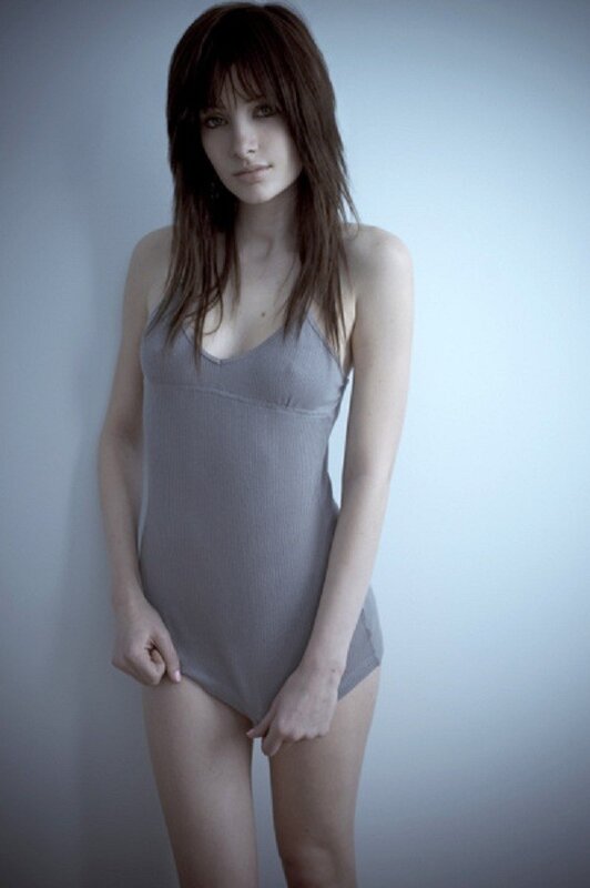 woman in gray bodysuit