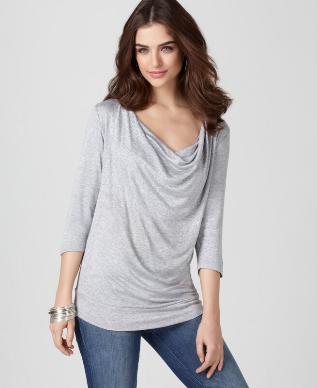 woman in gray cowl neck top