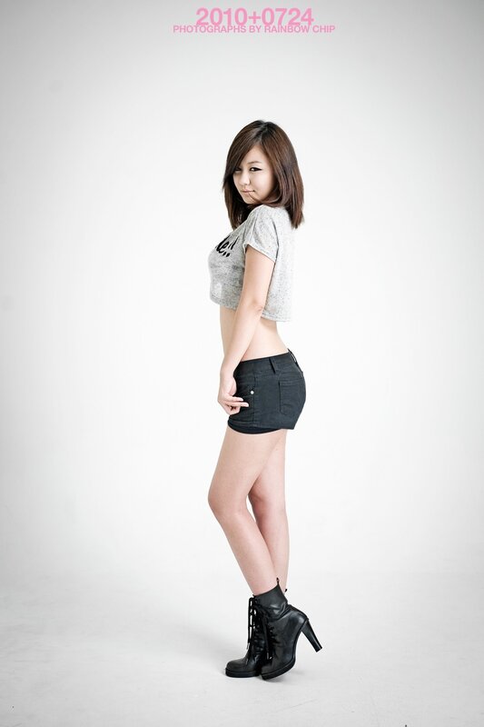 woman in gray crop top and black shorts