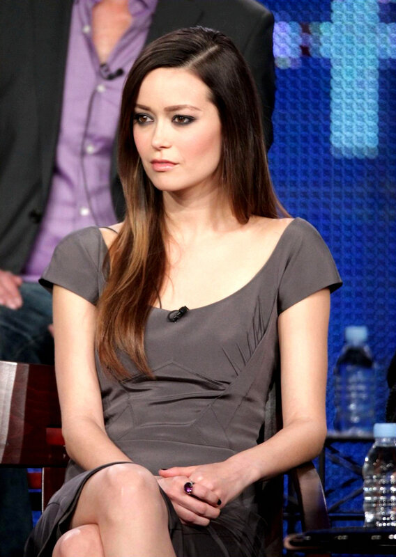 woman in gray dress at panel