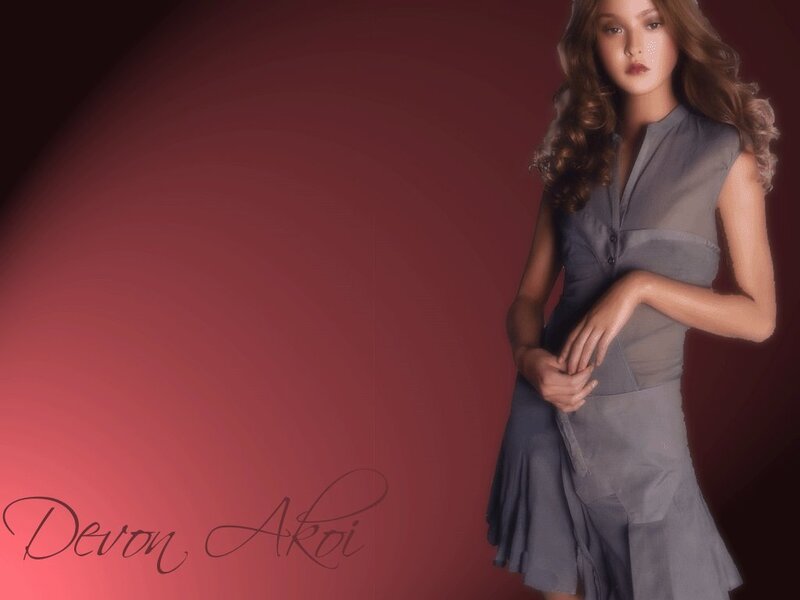 Woman in gray dress on red background