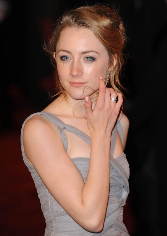 woman in gray dress on red carpet