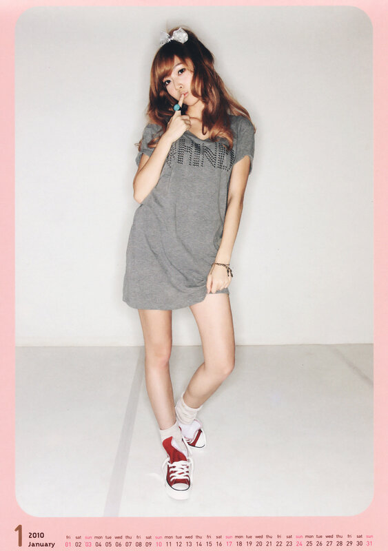 woman in gray dress posing