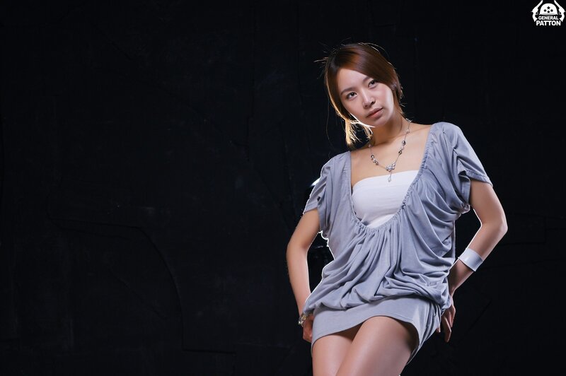 woman in gray dress posing