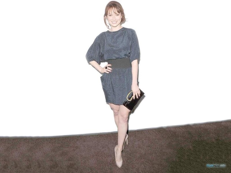 woman in gray dress posing