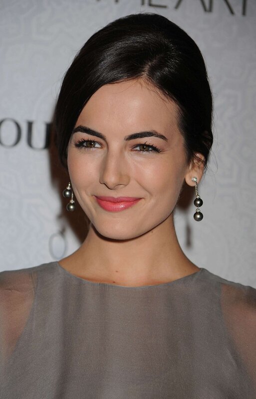 woman in gray dress smiling