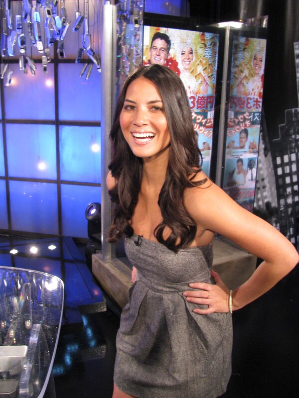 Woman in gray dress smiling