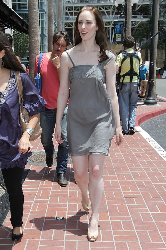 Woman in gray dress walking