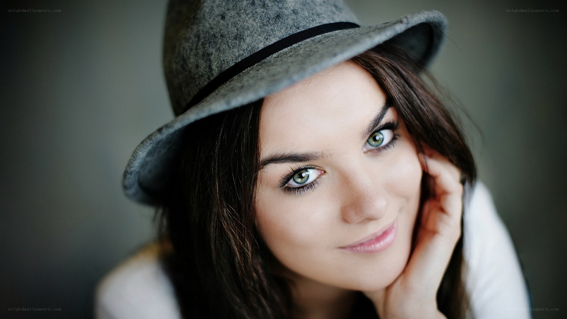 woman in gray hat smiling