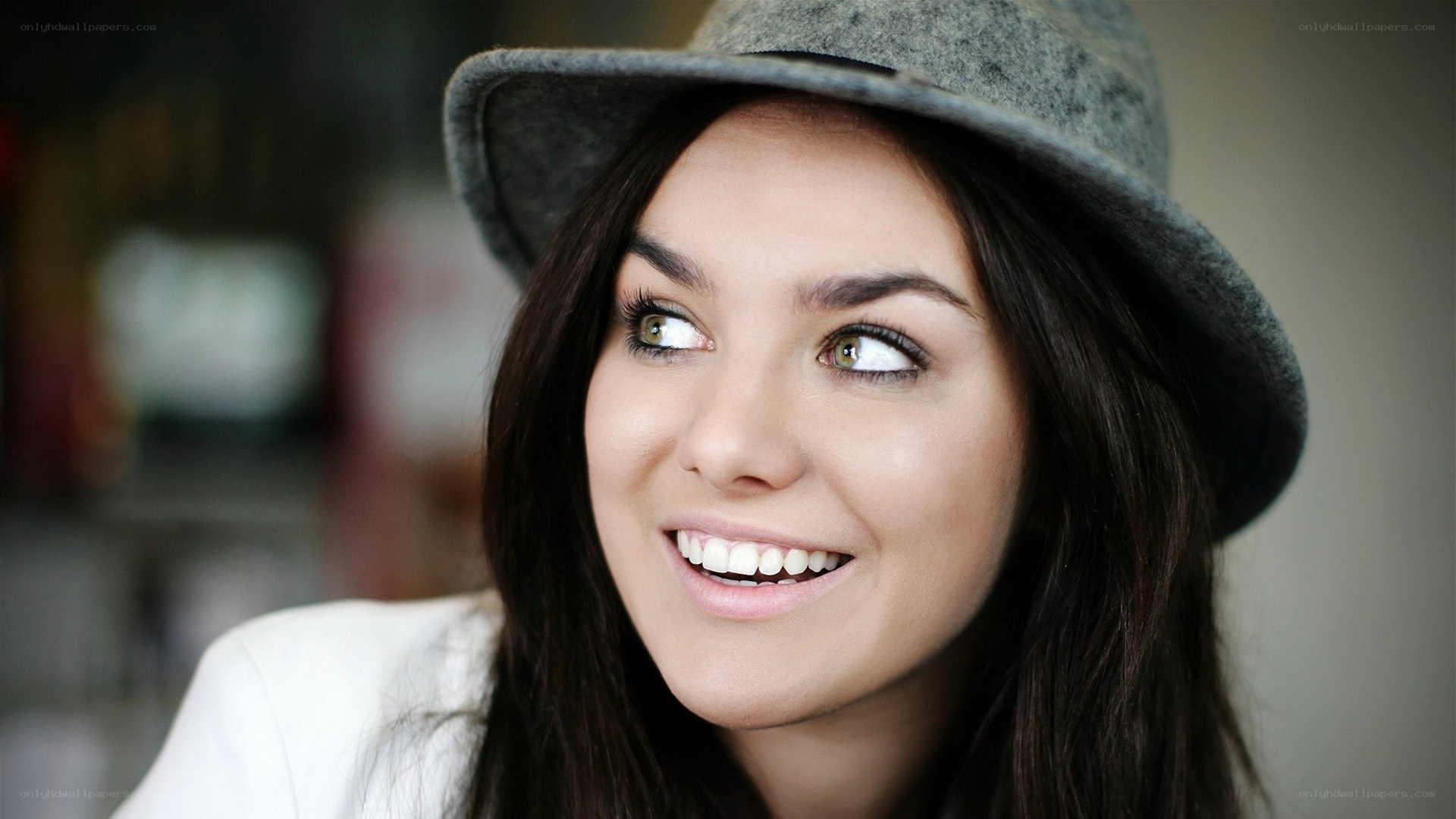 woman in gray hat smiling