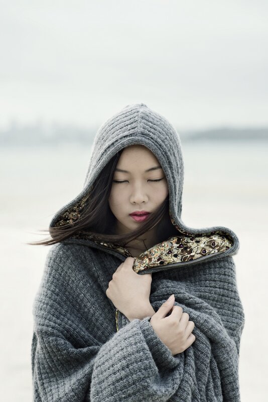 woman in gray hooded cloak
