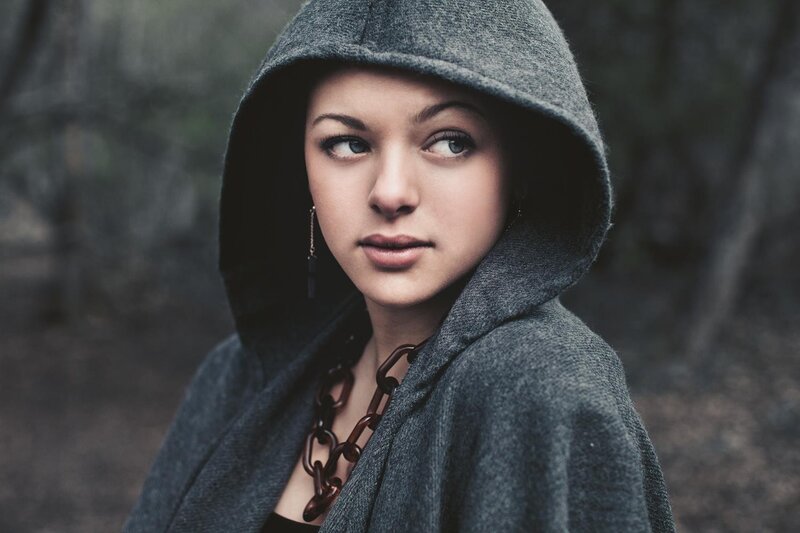 woman in gray hooded cloak