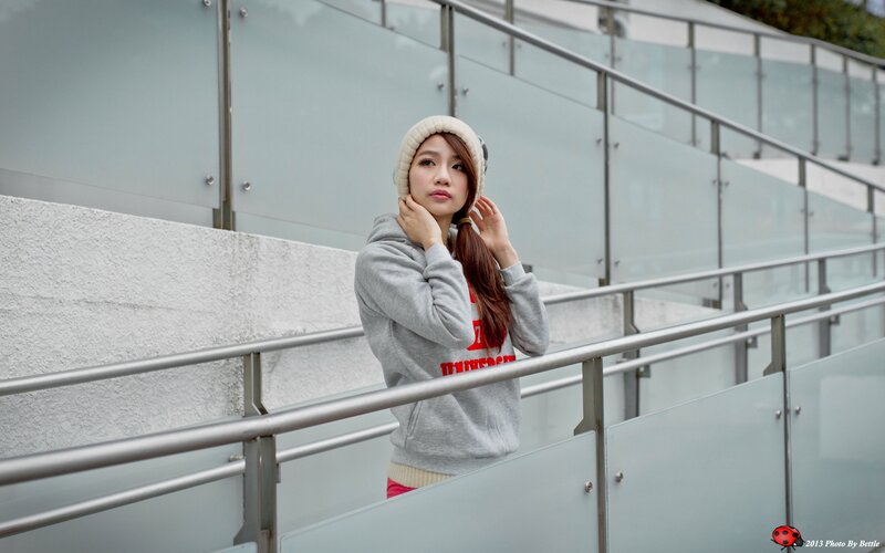 woman in gray hoodie on stairs
