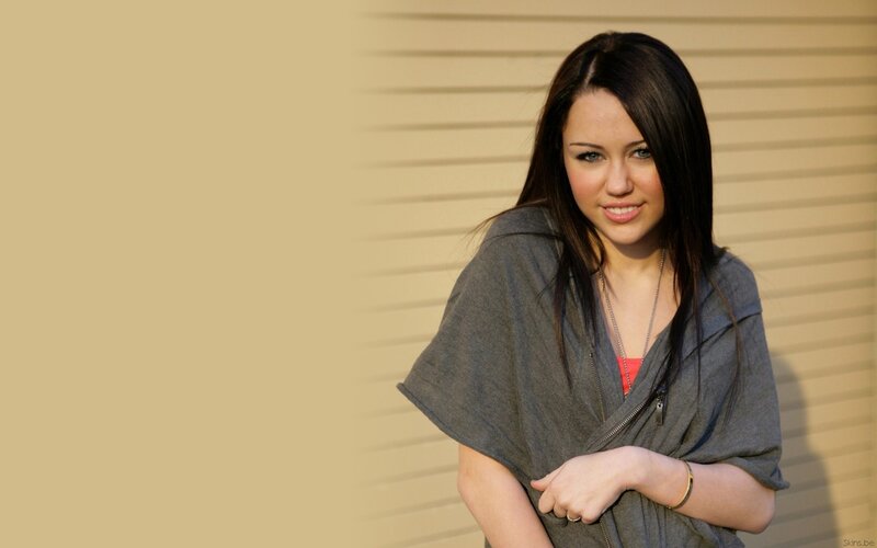 woman in gray hoodie smiling