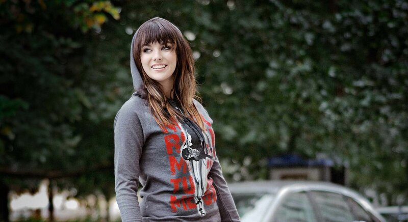 woman in gray hoodie smiling