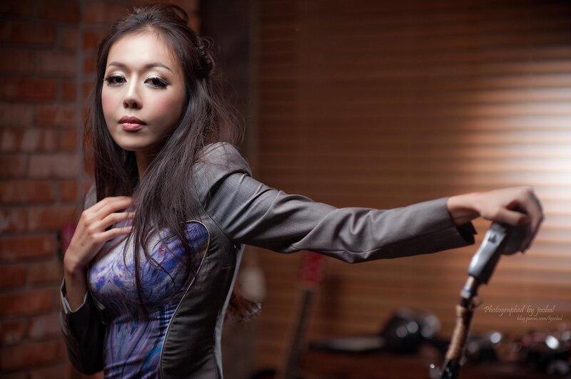 woman in gray jacket posing