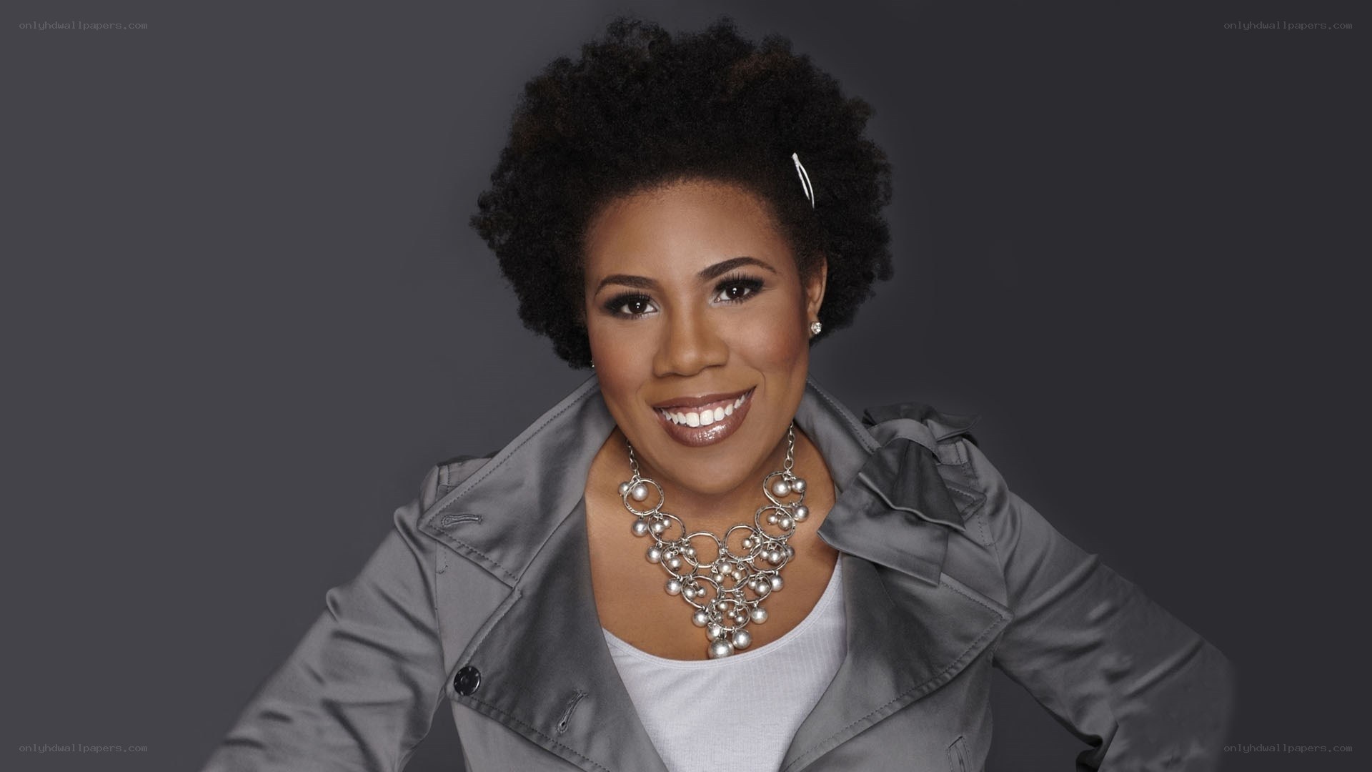 woman in gray jacket smiling