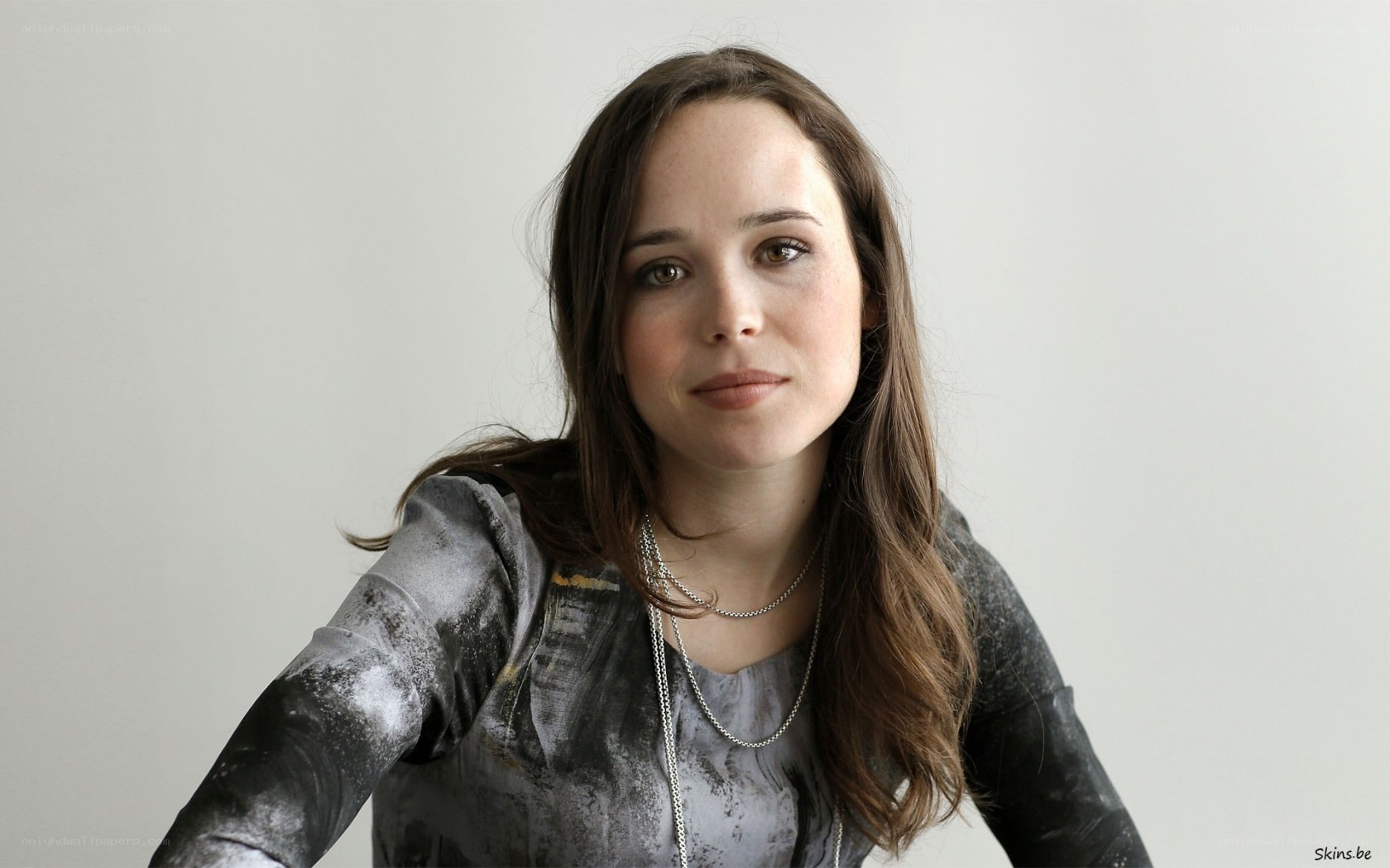 woman in gray patterned shirt