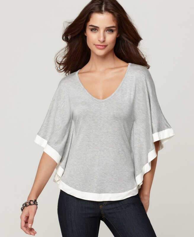 woman in gray poncho top