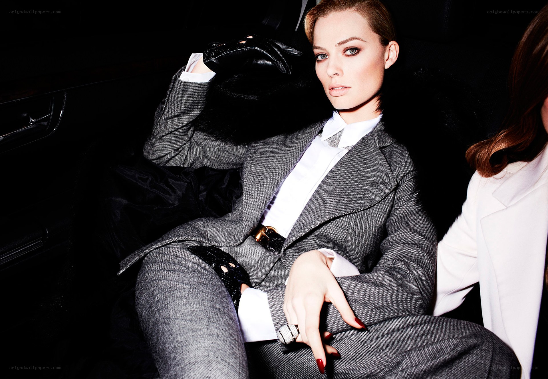 woman in gray suit in car