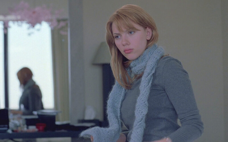 woman in gray sweater