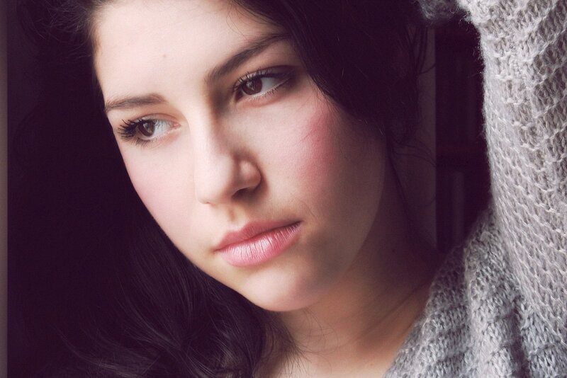 woman in gray sweater