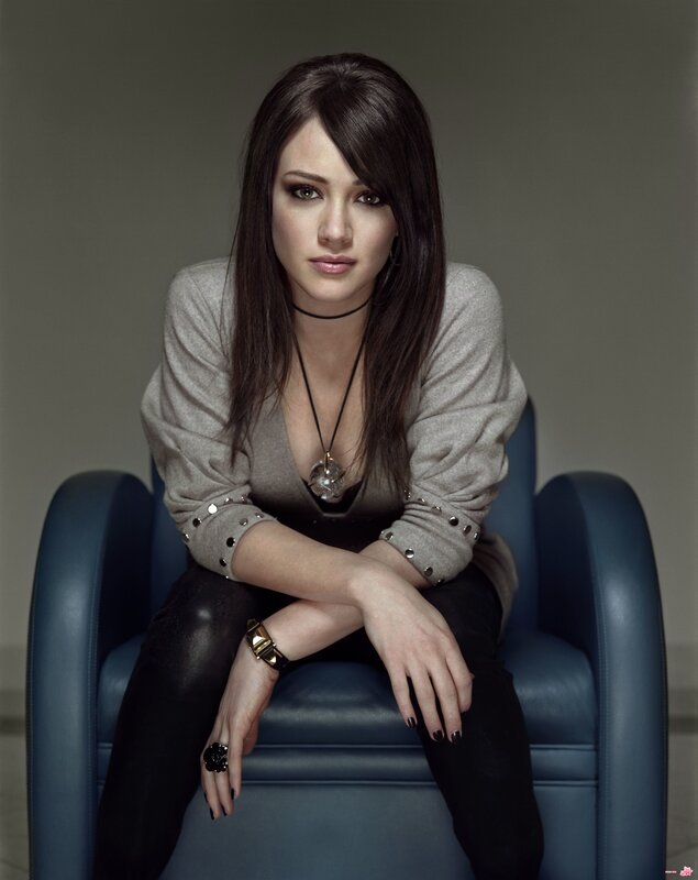 woman in gray sweater sitting
