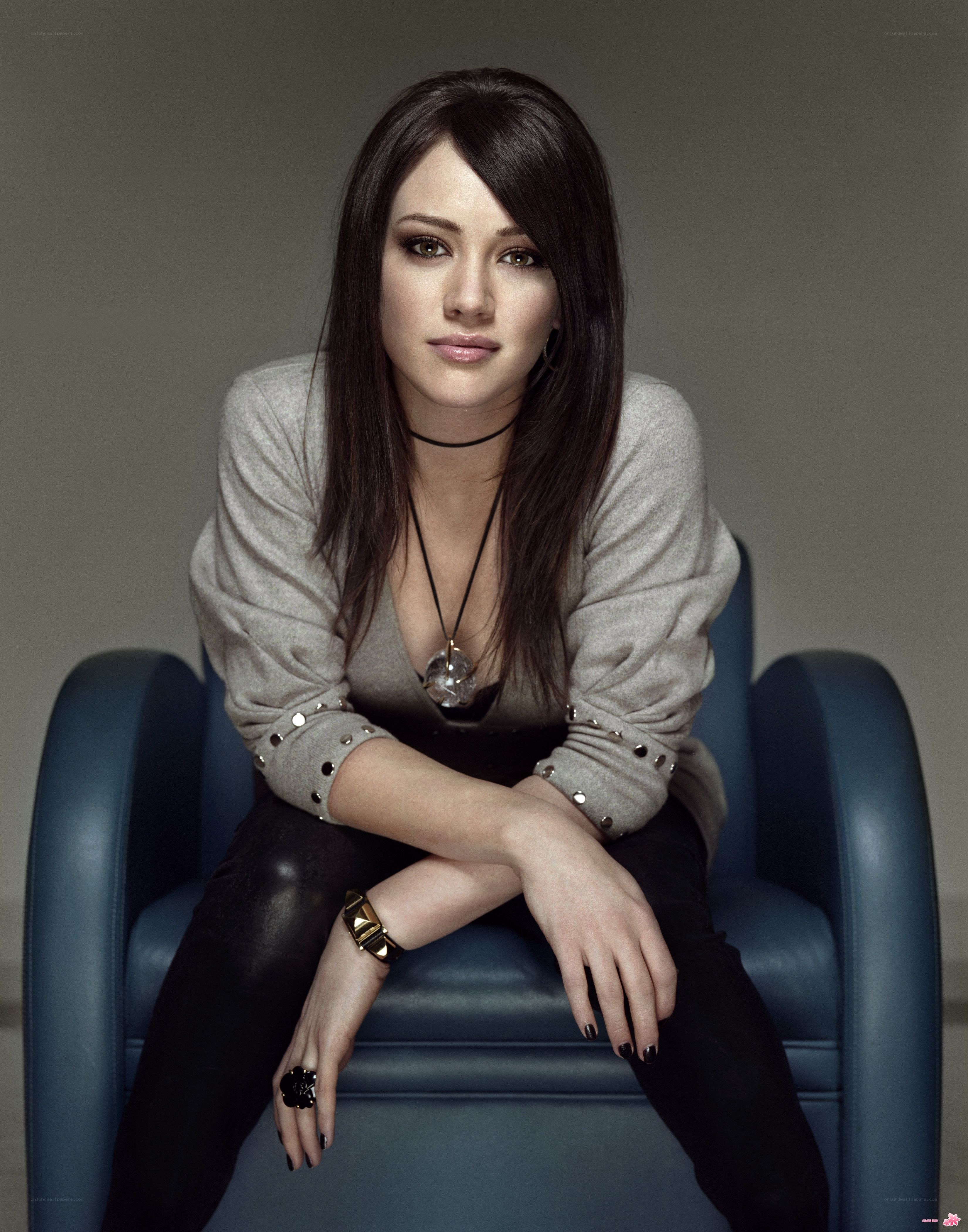 woman in gray sweater sitting