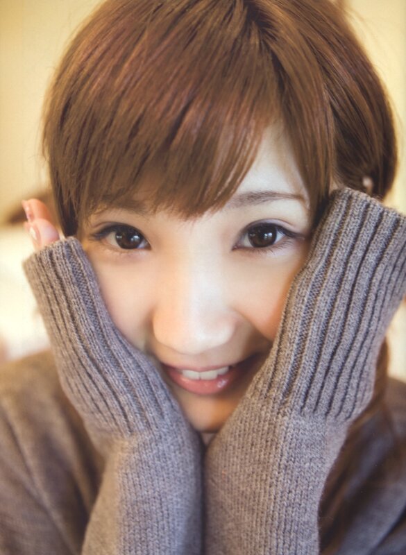 woman in gray sweater smiling