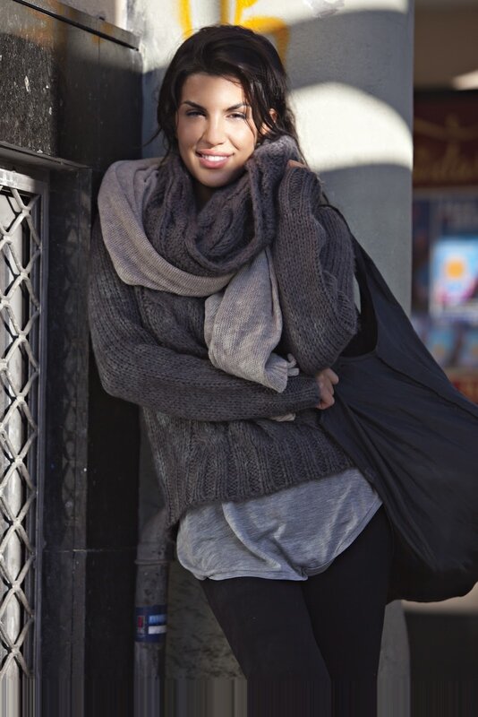 woman in gray sweater smiling