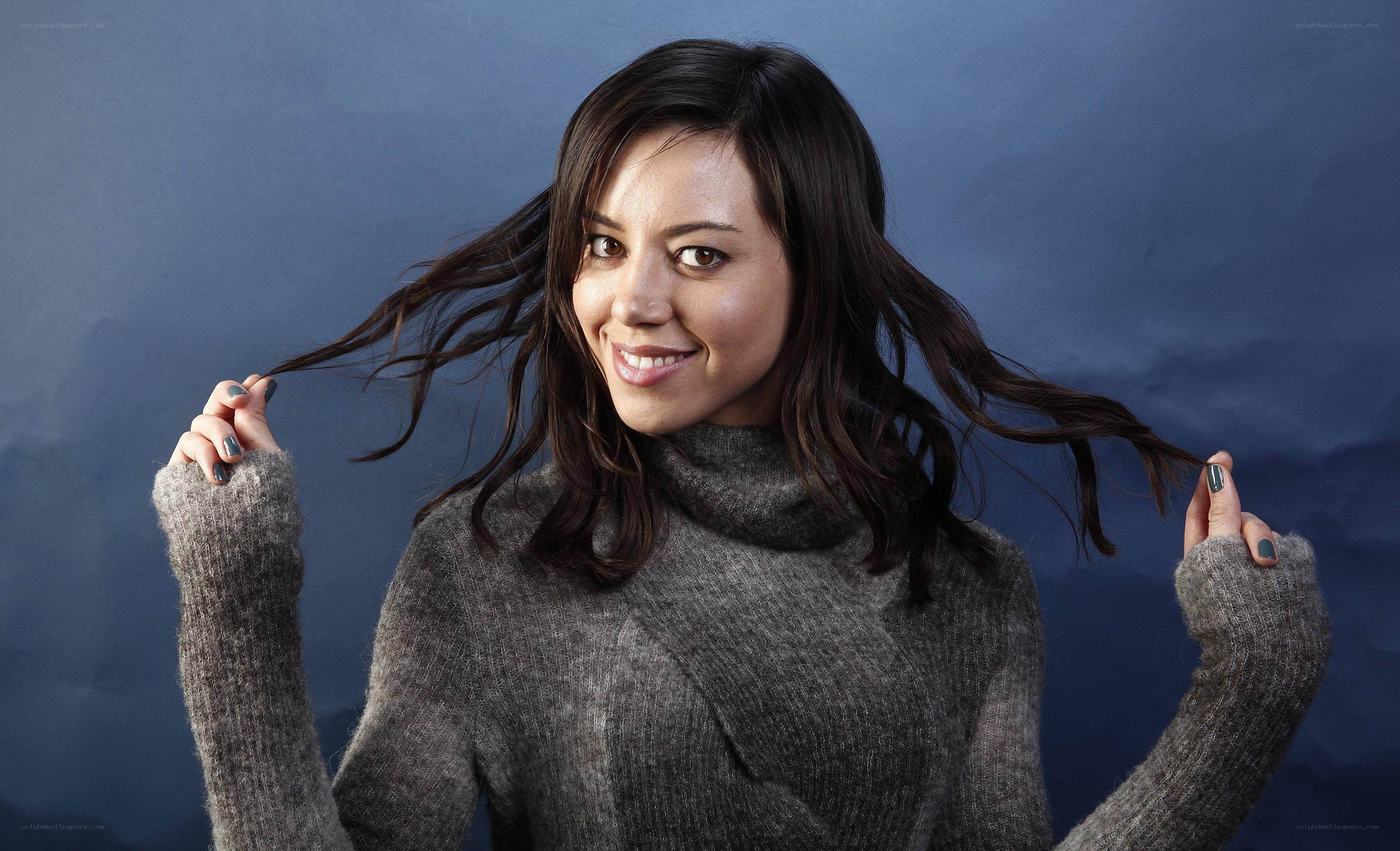 woman in gray sweater smiling