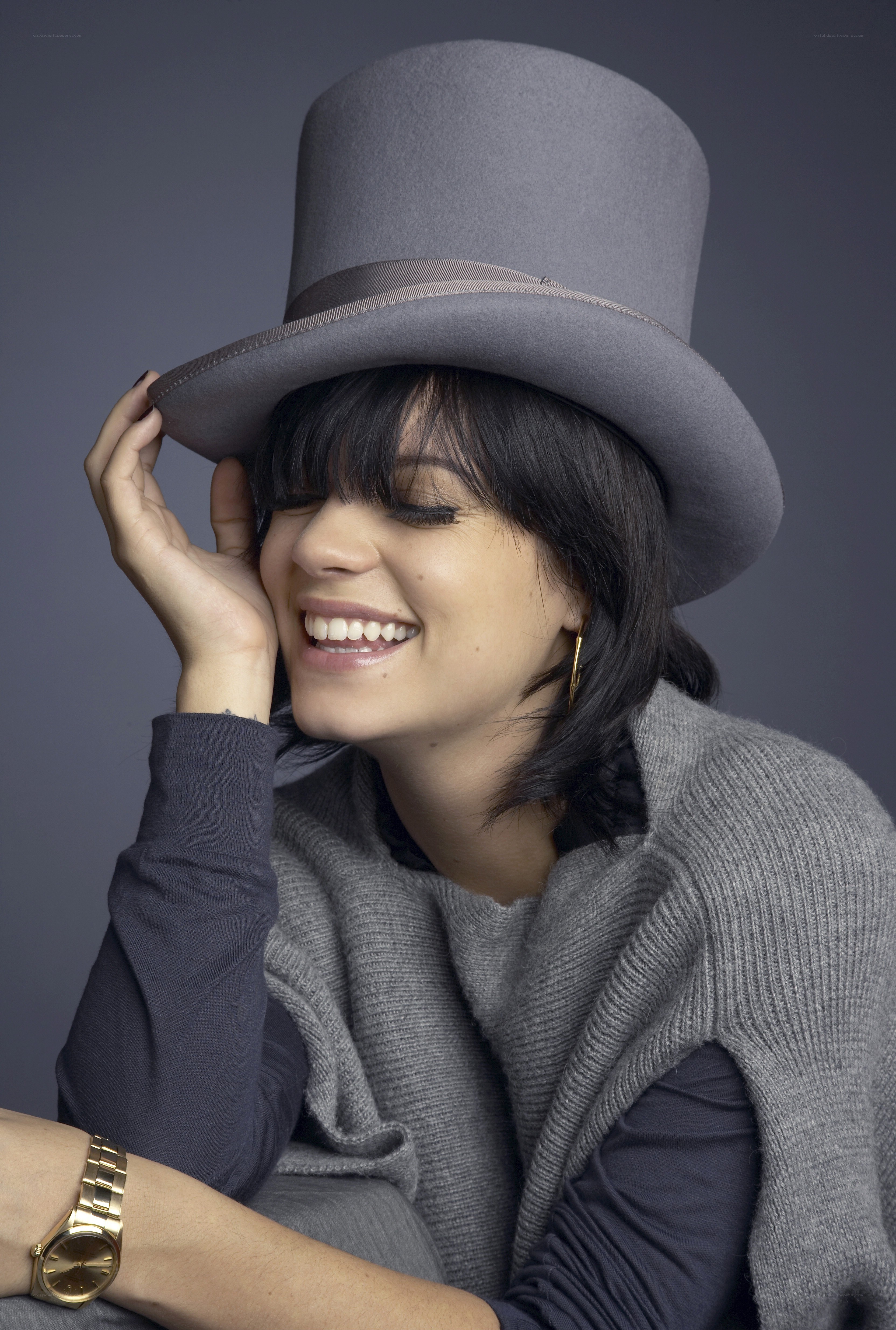 woman in gray top hat smiling