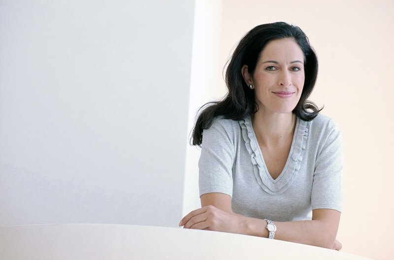 woman in gray top smiling