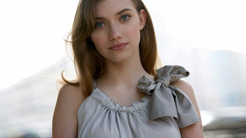 woman in gray top with bow