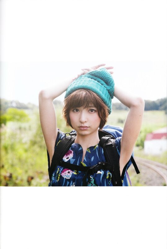 woman in green beanie outdoors
