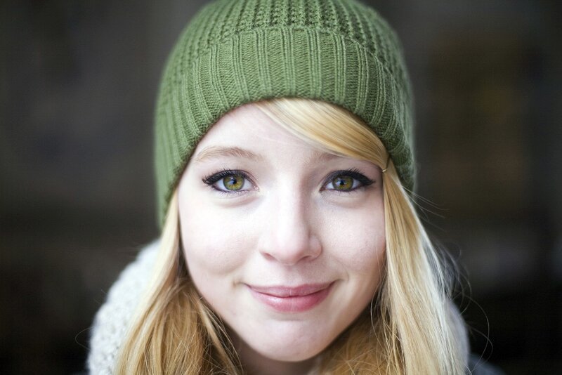 woman in green beanie