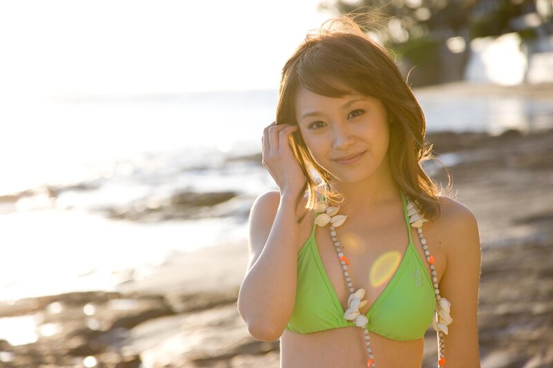 Woman in green bikini at beach