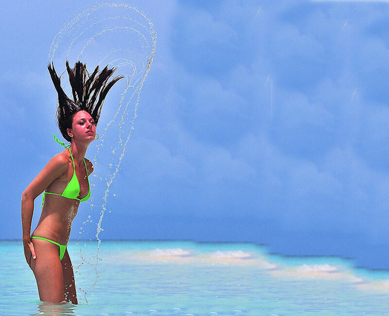 woman in green bikini at beach