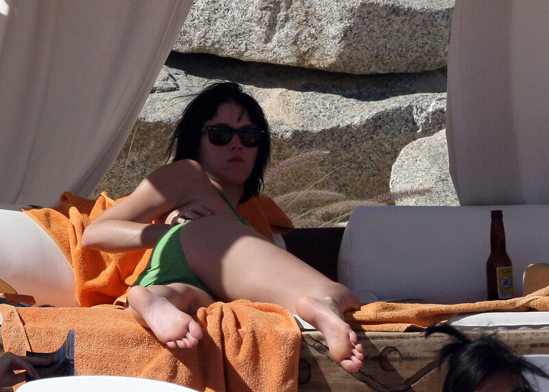 Woman in green bikini on lounge