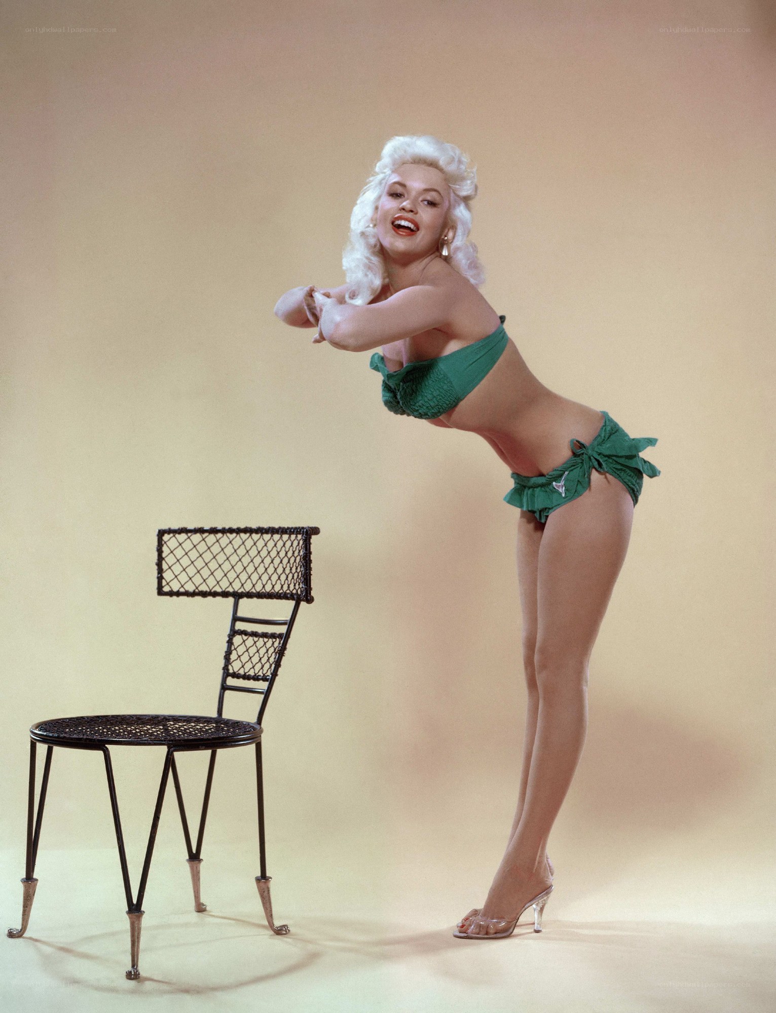 Woman in green bikini posing