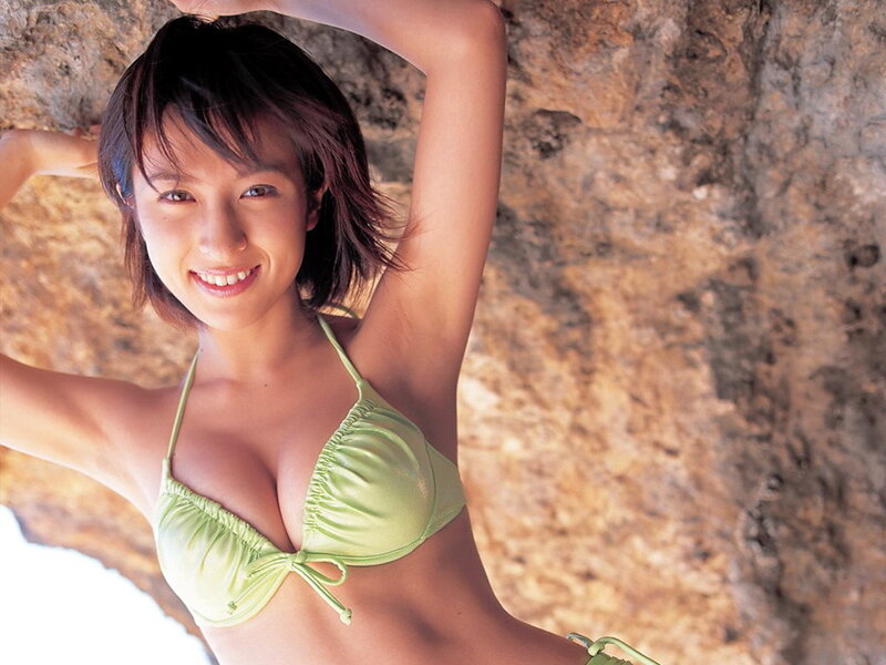 Woman in green bikini smiling