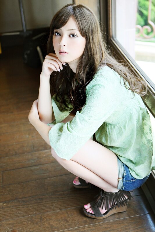 woman in green blouse crouching