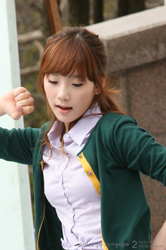 woman in green cardigan