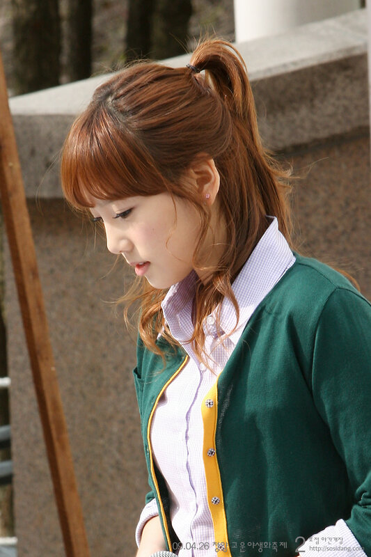 woman in green cardigan