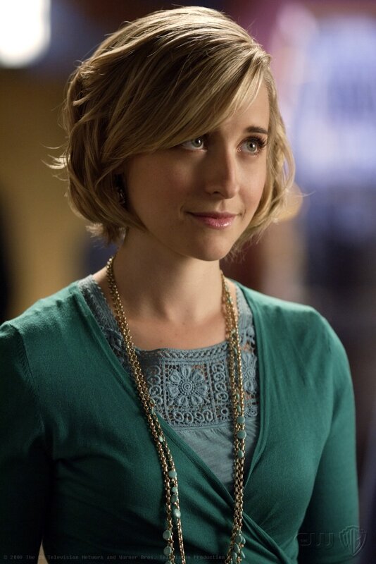 woman in green cardigan