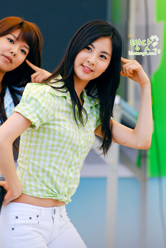 woman in green checkered shirt