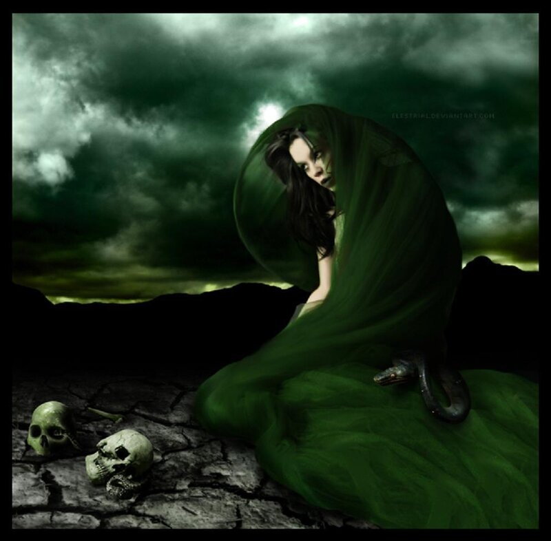 woman in green cloak with skulls
