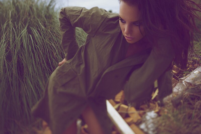 woman in green coat outdoors